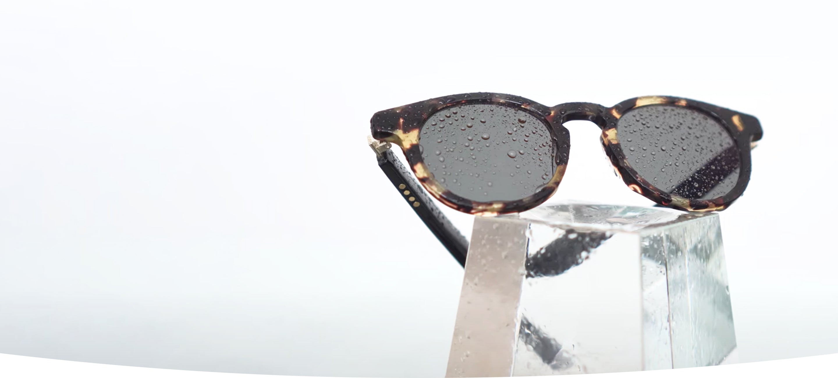 Person wearing Vue smart glasses while walking outdoors